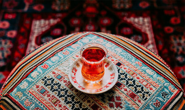 Cup of tea with handicrafts